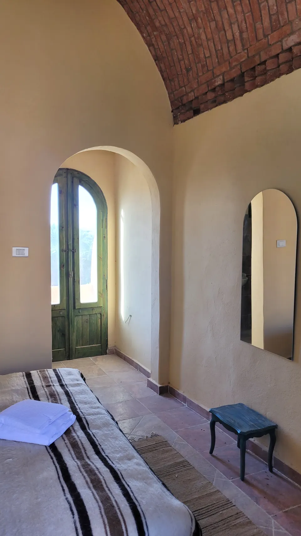 A room view towards the arched doorway · Standard