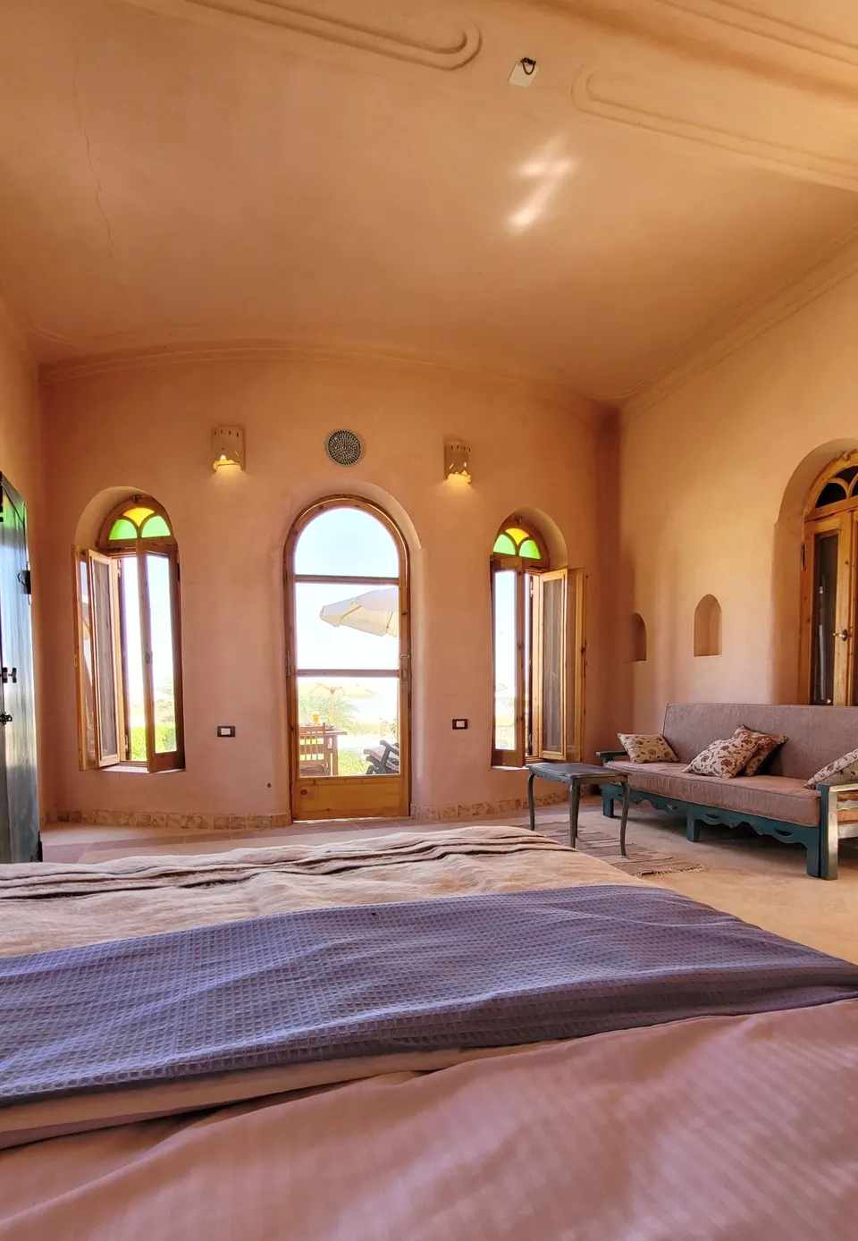 A room view towards the tall windows · Suite