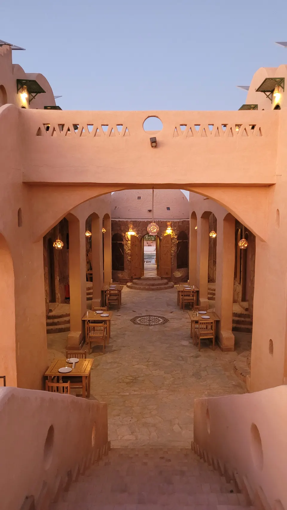 A view into the lodge courtyard at dusk