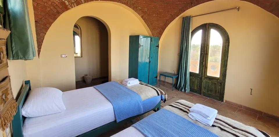 Another view of the beds and arched windows · Panorama