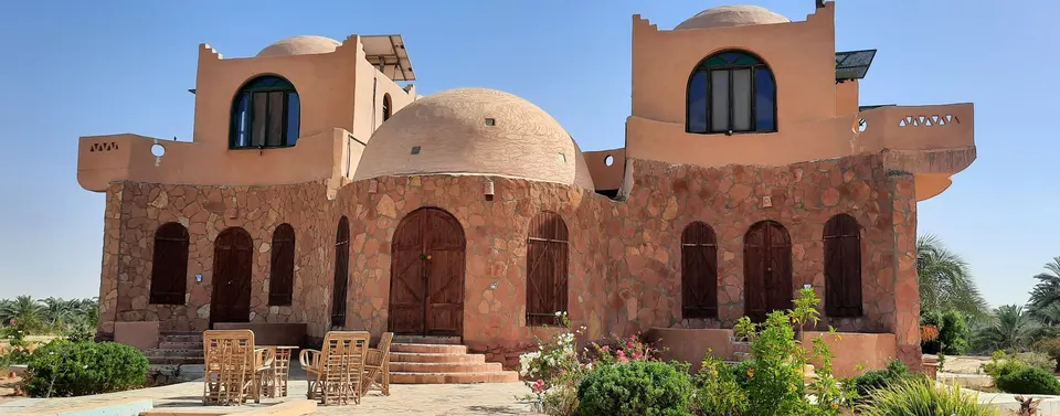 The lodge entrance with sand-coloured walls and domes