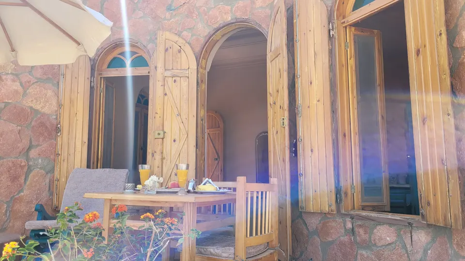 The terrace outside the open wooden doors · Suite